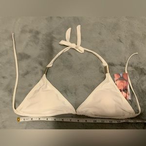 White bikini top with silver accents on strap